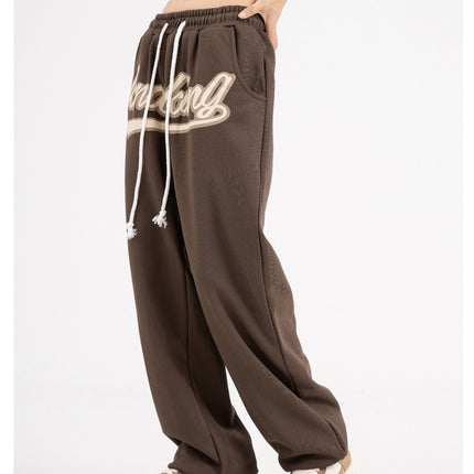 Unisex hip-hop sweatpants, streetwear joggers, relaxed fit pants, casual street style, urban fashion, lightweight joggers, breathable sweatpants, adjustable drawstring, multiple pockets joggers, street fashion trousers, versatile joggers, hip-hop wardrobe, trendy casual pants, athletic joggers, everyday sweatpants, gym joggers, lounging pants, stylish sweatpants, men’s streetwear, women’s casual joggers.