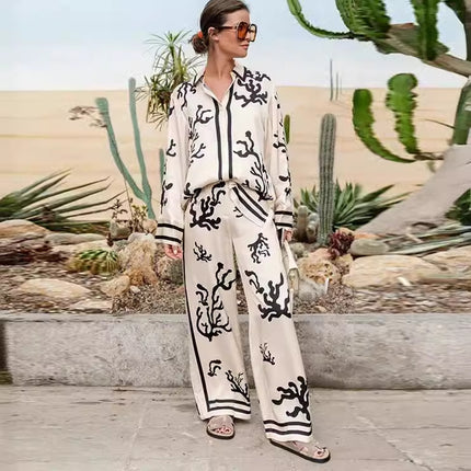 Elegant printed shirt and trousers set
Black and white co-ord for women
Stylish wide-leg pants outfit
Chic vacation outfit for women
Long-sleeve button-down shirt set
Trendy two-piece matching set
