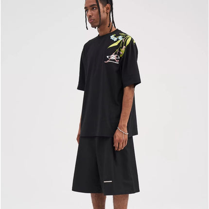 Oversized embroidered t-shirt
Floral embroidery t-shirt
Streetwear embroidered tee
Designer embroidered t-shirt
Unisex oversized t-shirt
Trendy streetwear fashion
High-quality embroidery tee