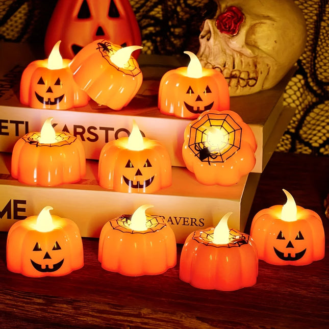 Halloween-themed decorative candles shaped like pumpkins on a wooden surface.