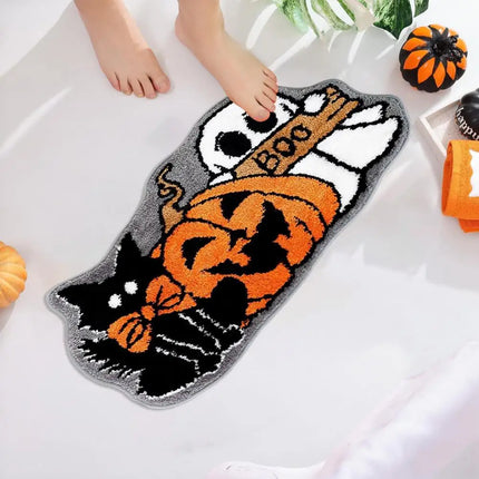 Halloween-themed bath mat with a cat, pumpkin, and ghost design on a white bathtub.
