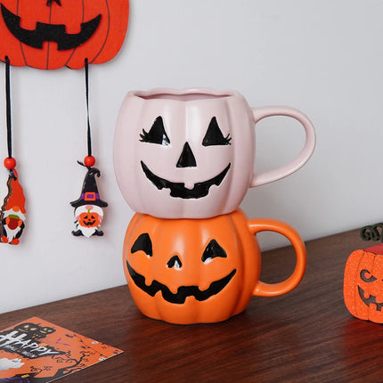 Halloween-themed mug with pumpkin design on a wooden surface.