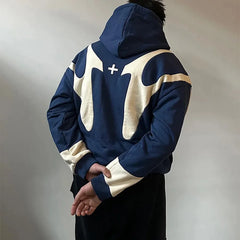 Person wearing a blue and white hoodie with a logo on a plain background