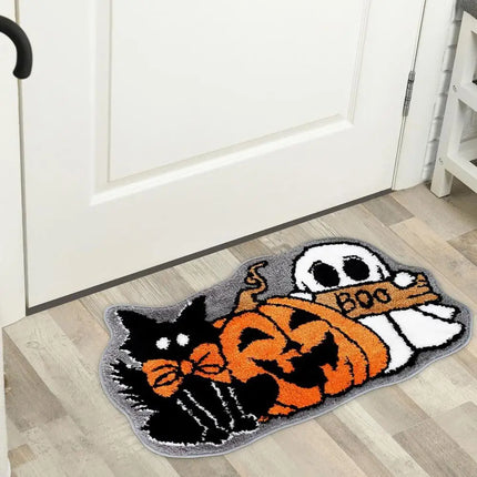 Halloween-themed doormat with a cat, pumpkin, and ghost design on a wooden floor.