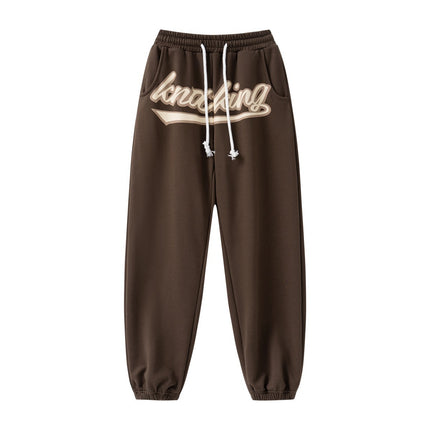 Unisex hip-hop sweatpants, streetwear joggers, relaxed fit pants, casual street style, urban fashion, lightweight joggers, breathable sweatpants, adjustable drawstring, multiple pockets joggers, street fashion trousers, versatile joggers, hip-hop wardrobe, trendy casual pants, athletic joggers, everyday sweatpants, gym joggers, lounging pants, stylish sweatpants, men’s streetwear, women’s casual joggers.