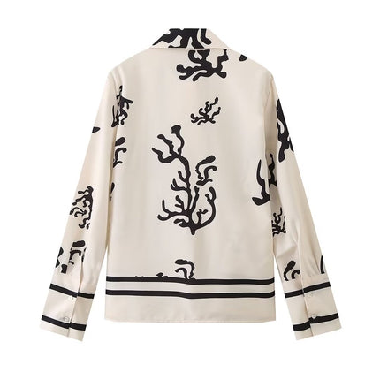 Elegant printed shirt and trousers set
Black and white co-ord for women
Stylish wide-leg pants outfit
Chic vacation outfit for women
Long-sleeve button-down shirt set
Trendy two-piece matching set