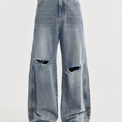 men's wide-leg jeans, ripped denim, vintage wash jeans, baggy streetwear jeans, loose-fit jeans, trendy men's denim, casual street style, frayed knee jeans, urban fashion.